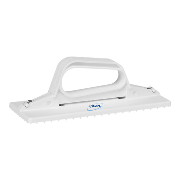 A white plastic Vikan handheld scrub pad holder.