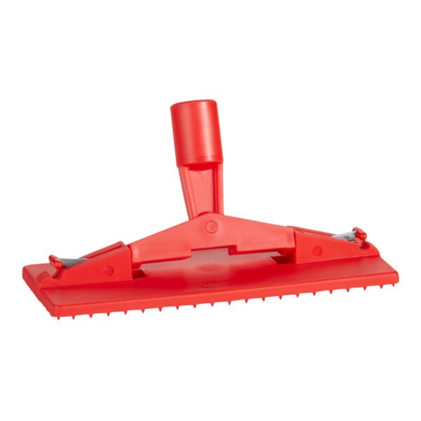 A close up of a red plastic Vikan 55004 scrub pad holder.