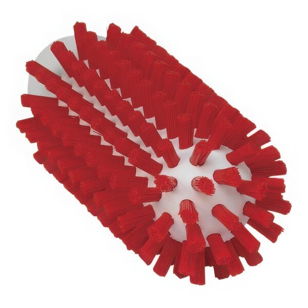 A red Vikan tube brush with many stiff bristles.