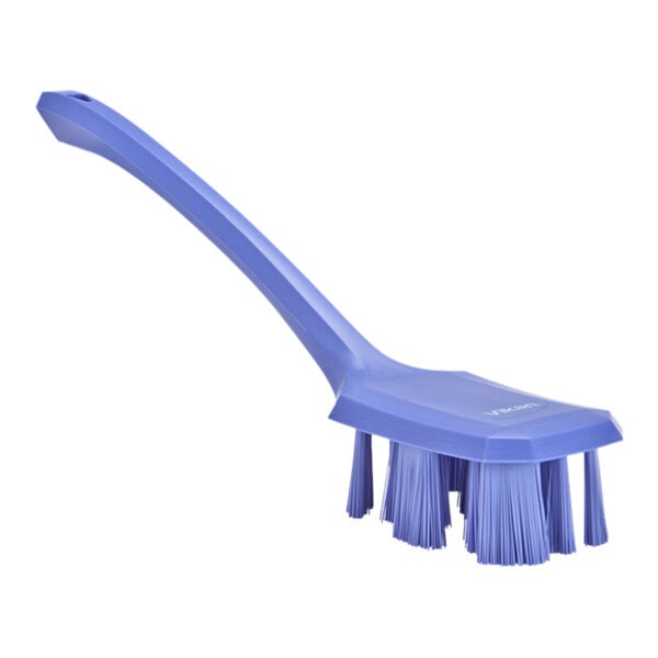 A purple Vikan hand brush with a long handle.