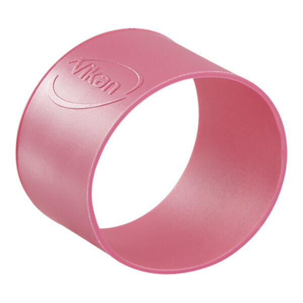 A close-up of a pink Vikan rubber band with a logo on it.