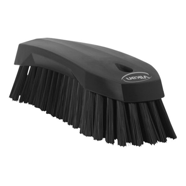 A Vikan black scrub brush with stiff black bristles.