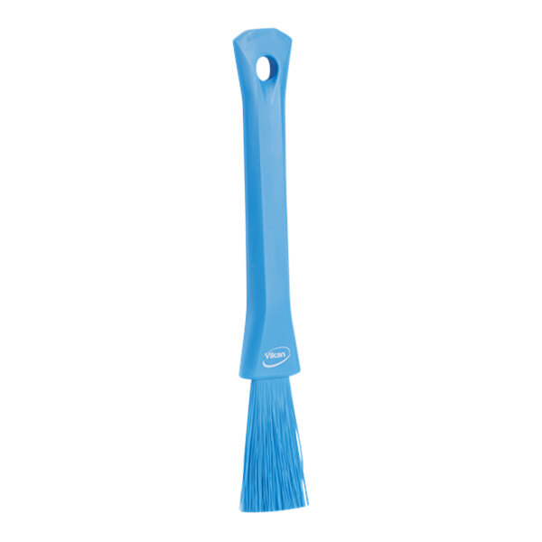 A blue Vikan detail brush with a white background.