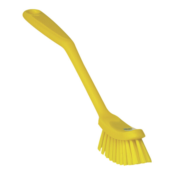 A close-up of a yellow Vikan narrow dish brush with a long handle.