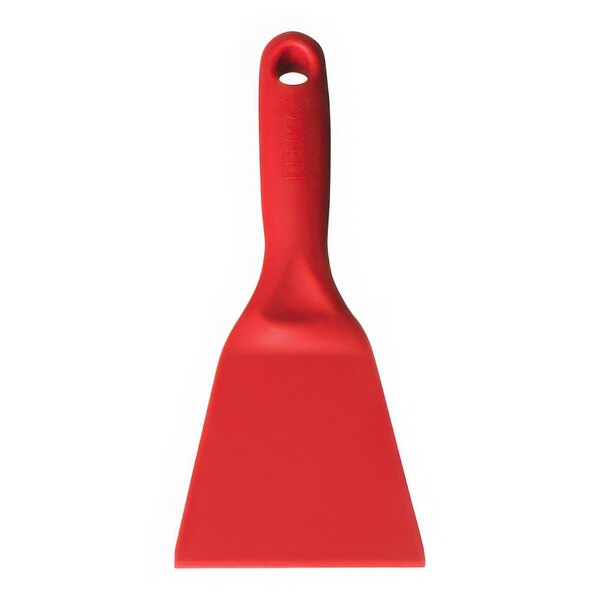 A red Vikan hand scraper with a hole in the handle.