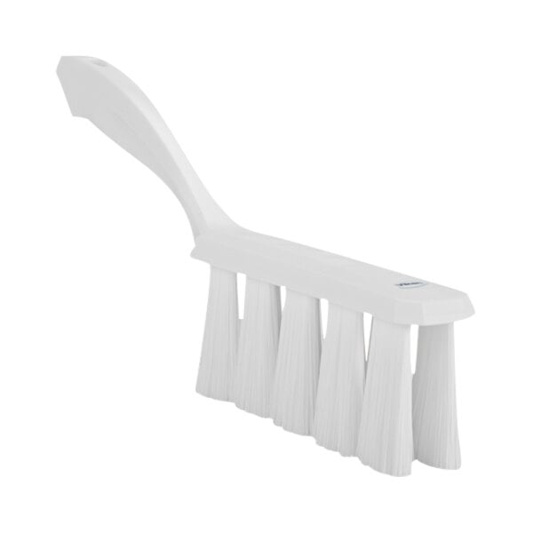 A close-up of a white Vikan bench brush with long bristles.