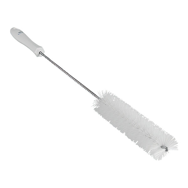 A white brush with a long handle.