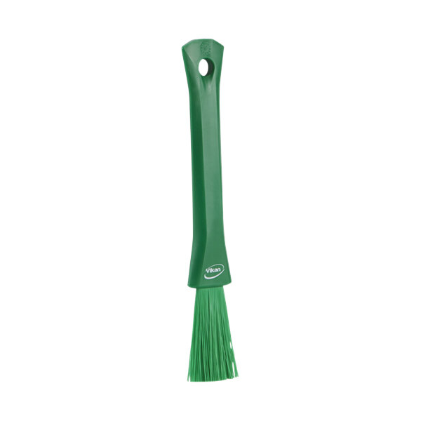 A green Vikan detail brush with a green handle.