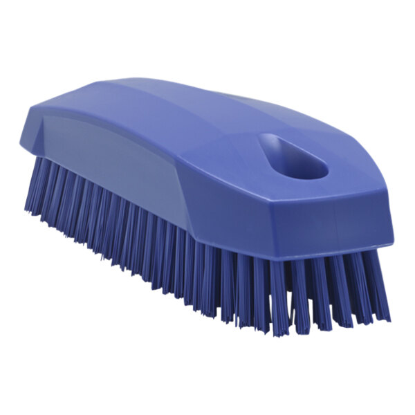 A blue hand brush with stiff bristles.