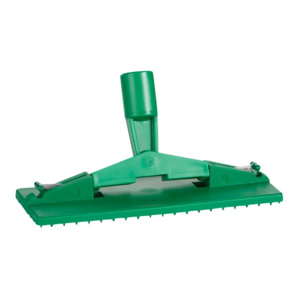A close up of a green Vikan scrub pad holder.