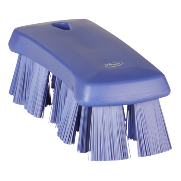 A purple Vikan hand brush with stiff bristles.