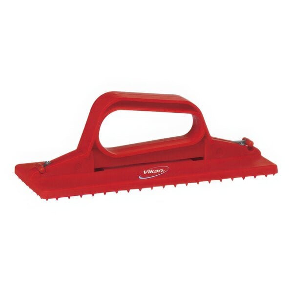 A red plastic Vikan handheld scrub pad holder.