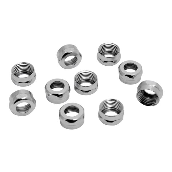 A close-up of a brass coupling nut with metal rings on the ends.