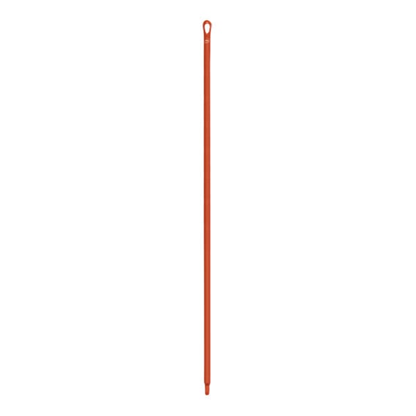 A long red plastic stick with a hole.