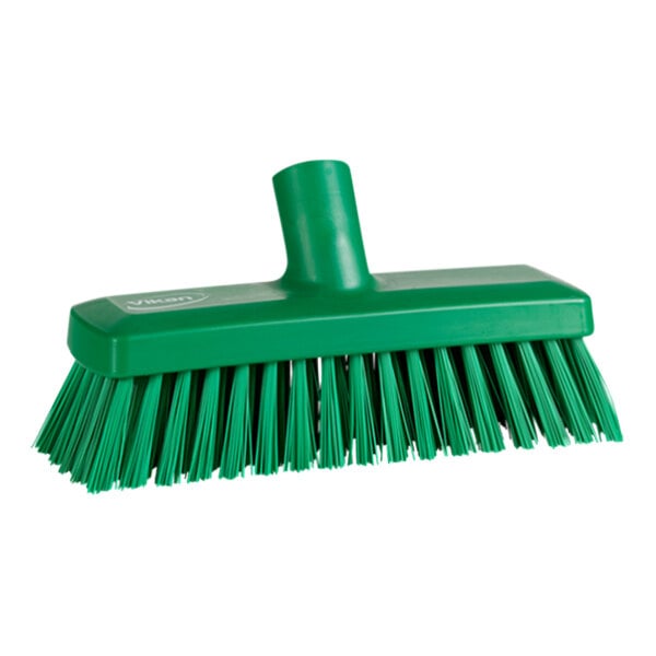 A close-up of a Vikan green wall/deck scrub head with stiff bristles.