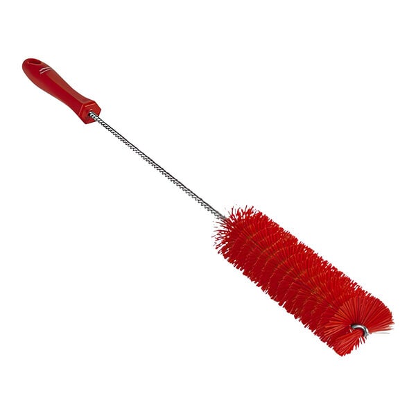 A red Vikan tube brush with a long handle.