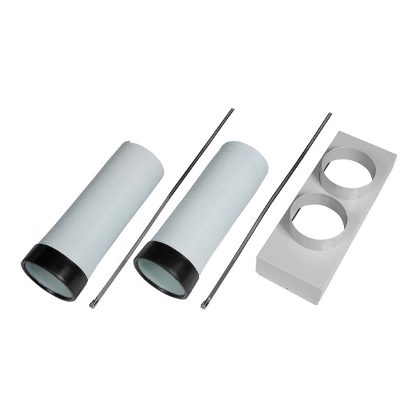 A white rectangular object with round holes containing several white plastic pipes with black handles.