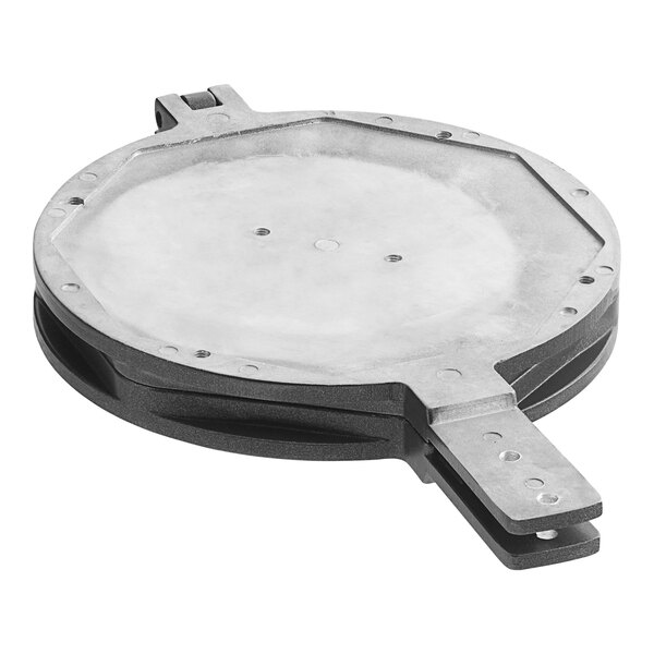 A round metal plate with metal handles and a hole in the middle.