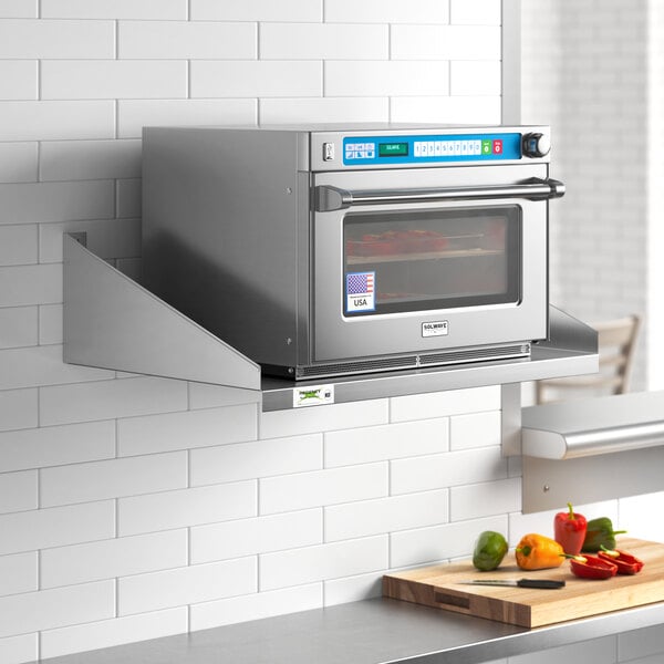 A stainless steel Regency microwave shelf above a stainless steel oven.