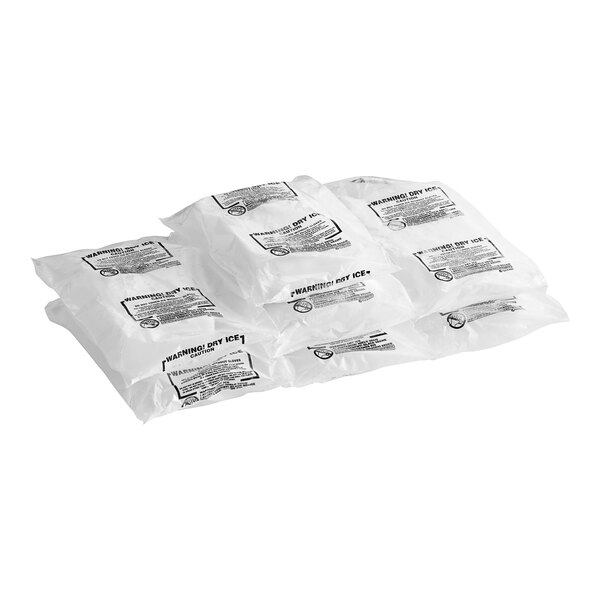 Several white plastic bags of 35 lb. dry ice with warning labels.