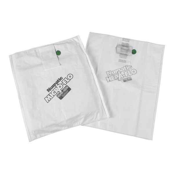 Two white plastic bags with green tags.