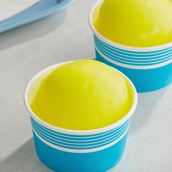 Two cups of Philadelphia Water Ice Pineapple Italian Ice.