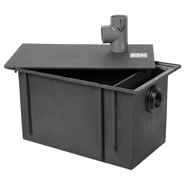 A black Zurn grease trap container with pipe connections.