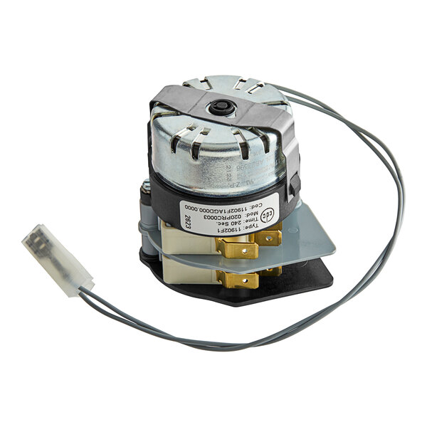 A small electric motor with wires and a wire harness for a Cooking Performance Group convection oven.