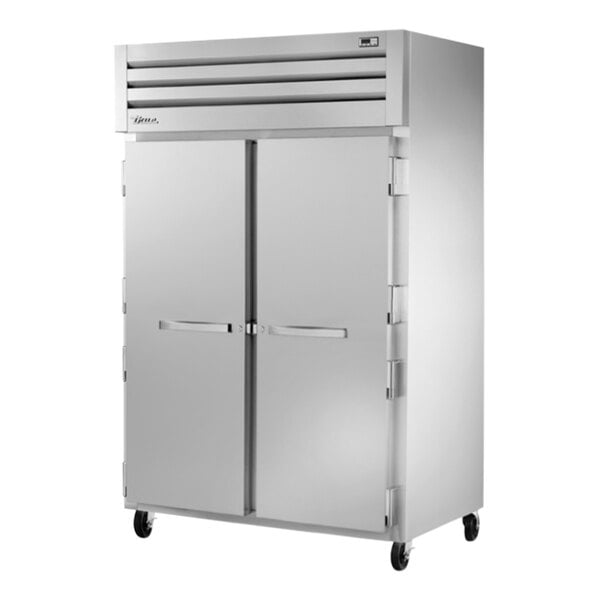 A True Spec Series white reach-in freezer with two solid doors.