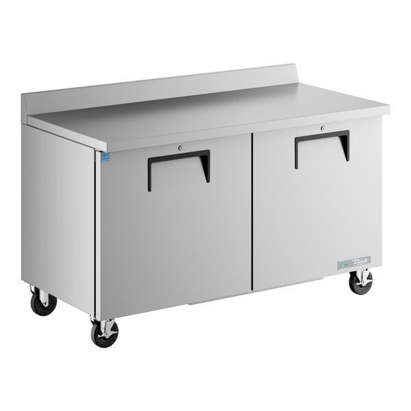 A True stainless steel worktop freezer with a backsplash on wheels.