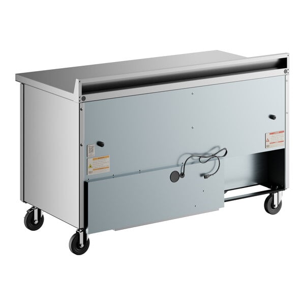 A stainless steel True worktop freezer on wheels.