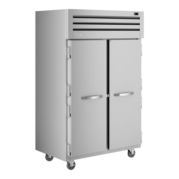 A white True Spec Series reach-in refrigerator with two solid doors.