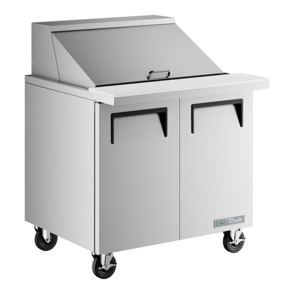 A True 2 door stainless steel refrigerated sandwich prep table.