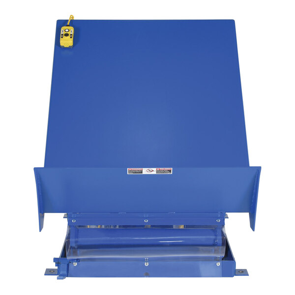 A blue rectangular Vestil tilt table with a yellow scissor lift.