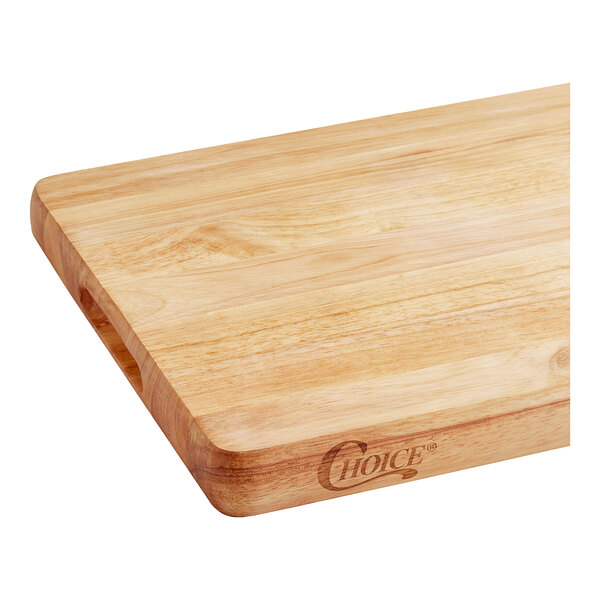 A natural wood Choice cutting board with rounded edges on a table in a home kitchen.