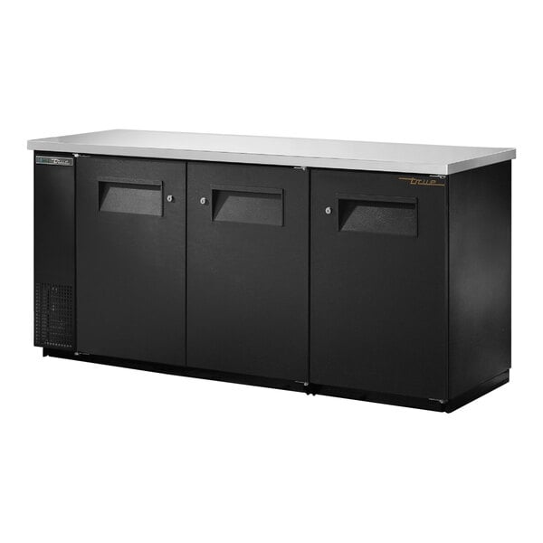 A black rectangular True back bar refrigerator with three solid doors.
