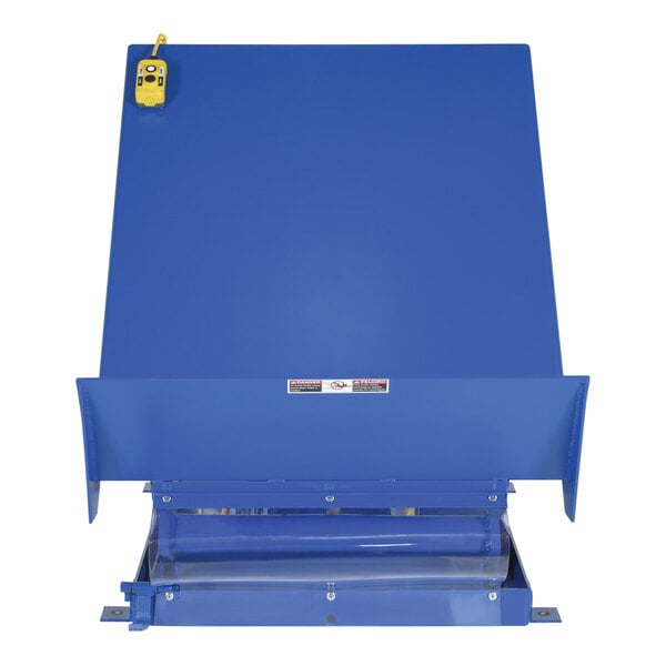 A blue rectangular Vestil tilt table with a yellow handle on it.