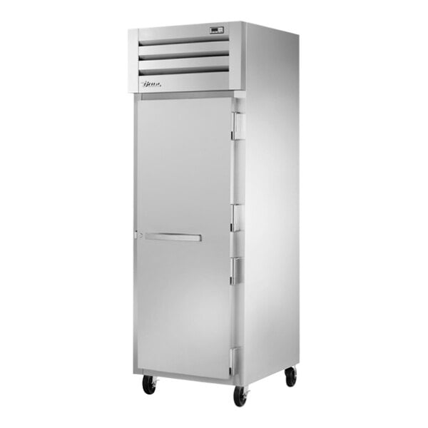 A True Spec Series reach-in freezer with a white door.