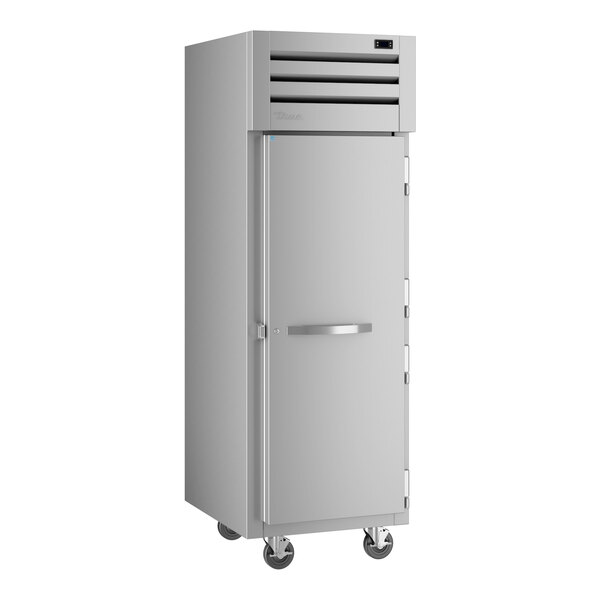 A True Spec Series reach-in freezer with a white solid door.