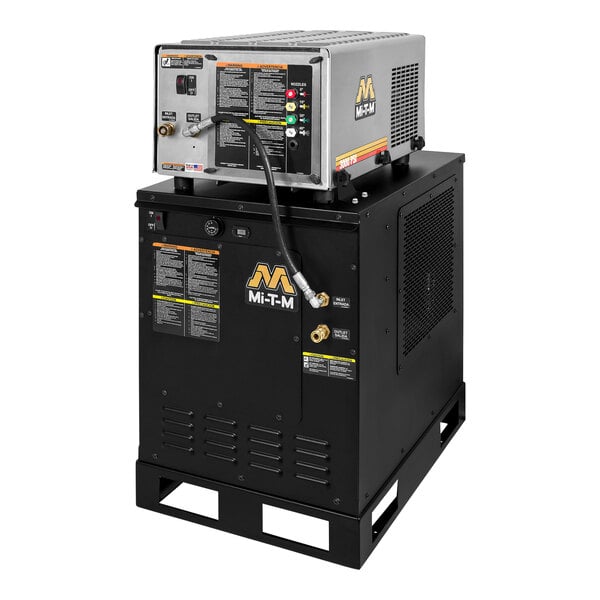A black Mi-T-M electric hot water pressure washer on top of a black box with a hose.