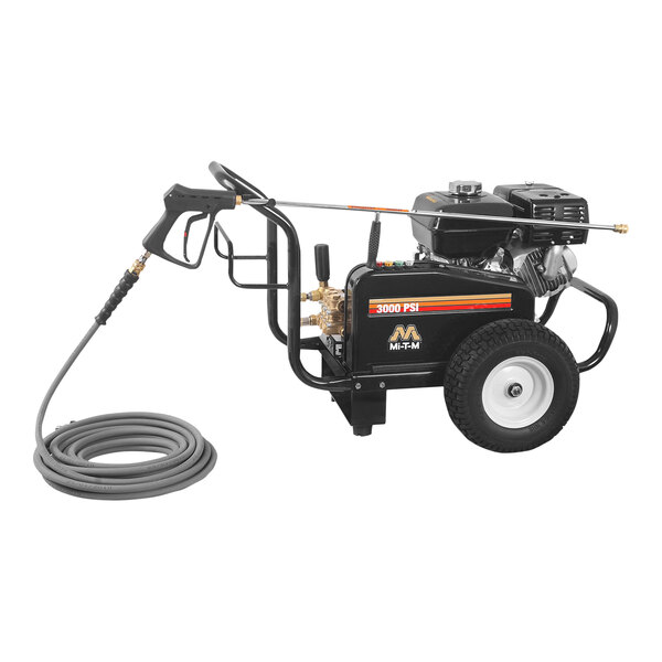 A Mi-T-M cold water pressure washer with a hose attached.