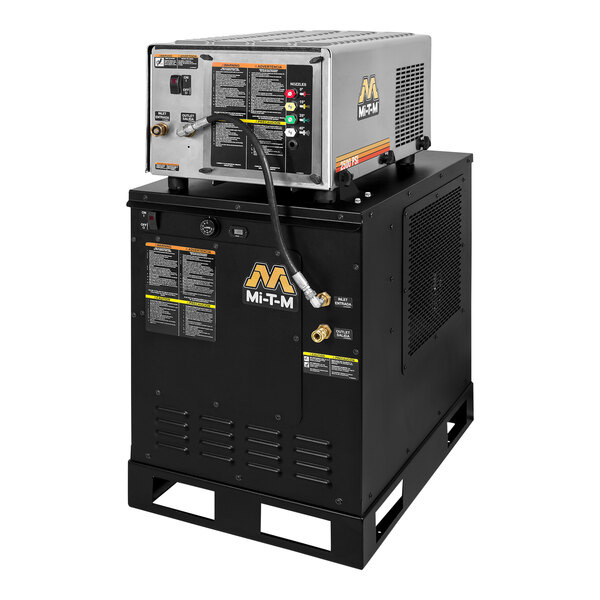 A white Mi-T-M hot water pressure washer with a black hose.