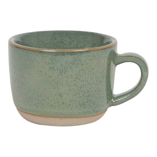 A green porcelain cup with a handle.