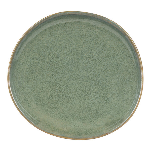 A close-up of a Front of the House Artefact moss green porcelain plate with a brown rim.