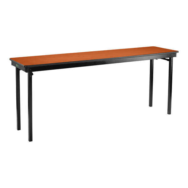 A National Public Seating rectangular folding table with black legs and a wild cherry top with T-mold edge.