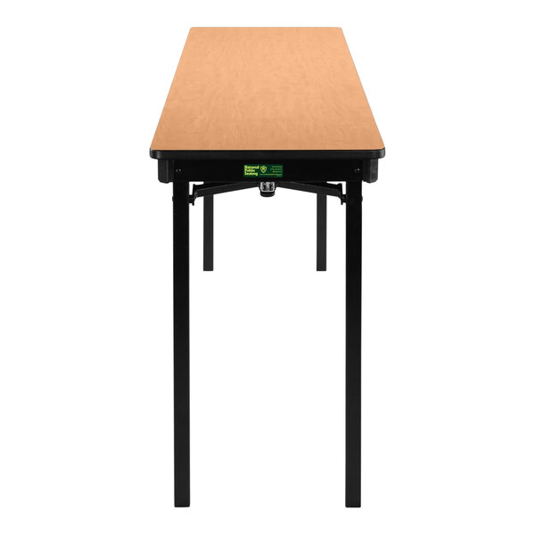 A National Public Seating rectangular folding table with legs and a light brown top.