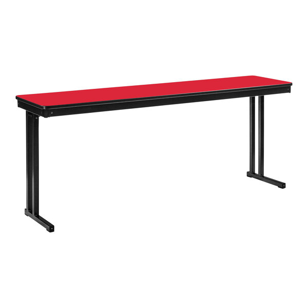 A rectangular red National Public Seating folding table with black legs.