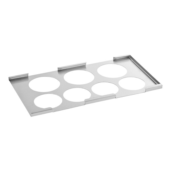 A silver metal tray with seven circles.