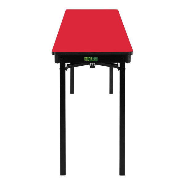 A red rectangular table with a black border and legs.