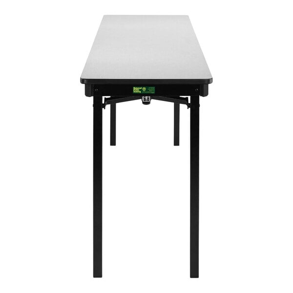 A National Public Seating gray rectangular folding table with black legs.